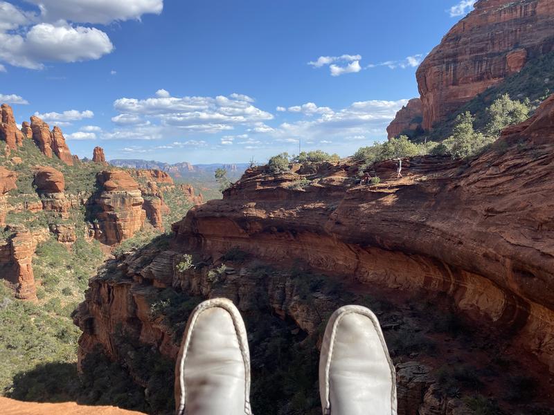White loafers at the edge of a Sedona cliff